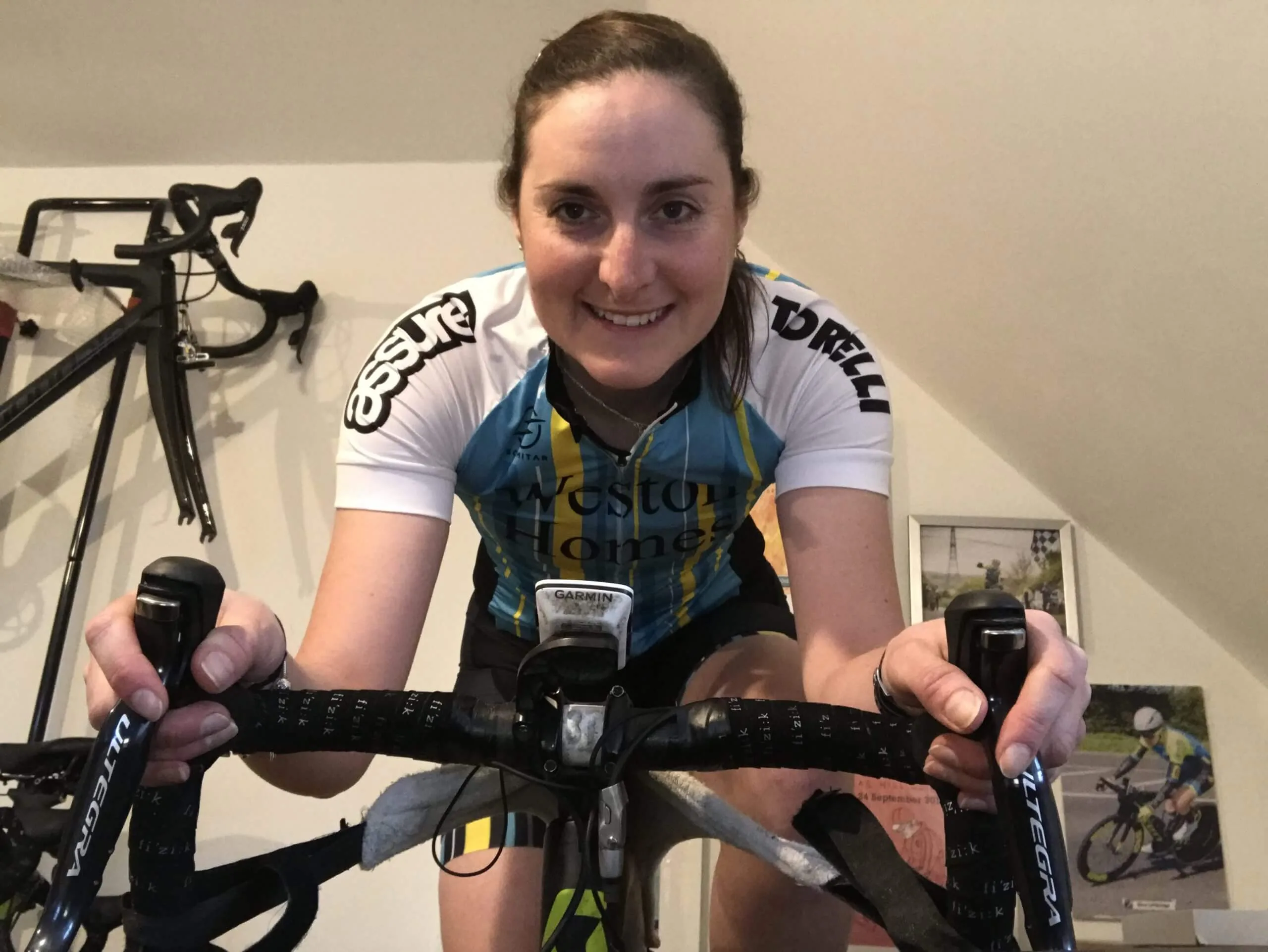 Alice on her stationary bike in her home during covid