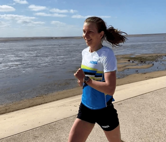 Hayley Carruthers Jogging next to a beach