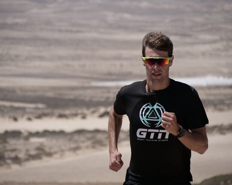 Mark Threlfall Jogging next to a beach