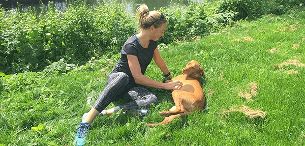 Susie Cheetham with her Dog in a field