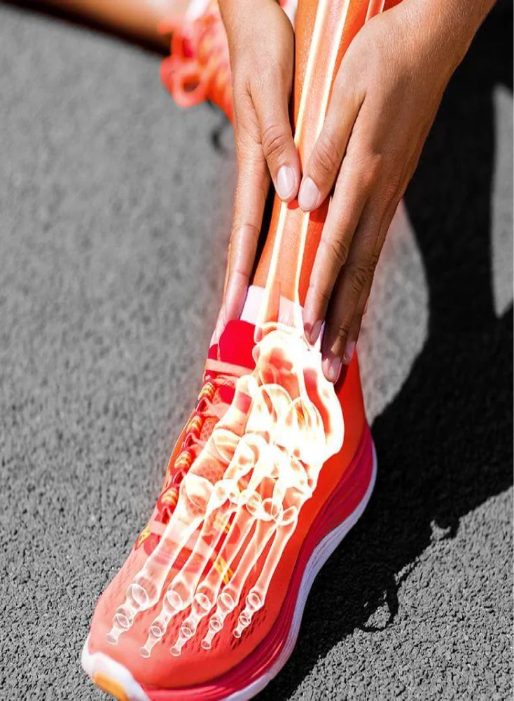 Graphic of an ankle injury with someone holding there leg