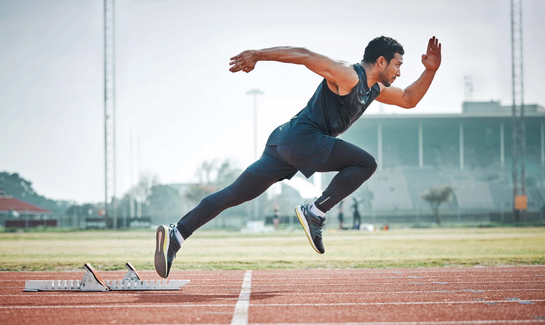 man sprinting on a running track