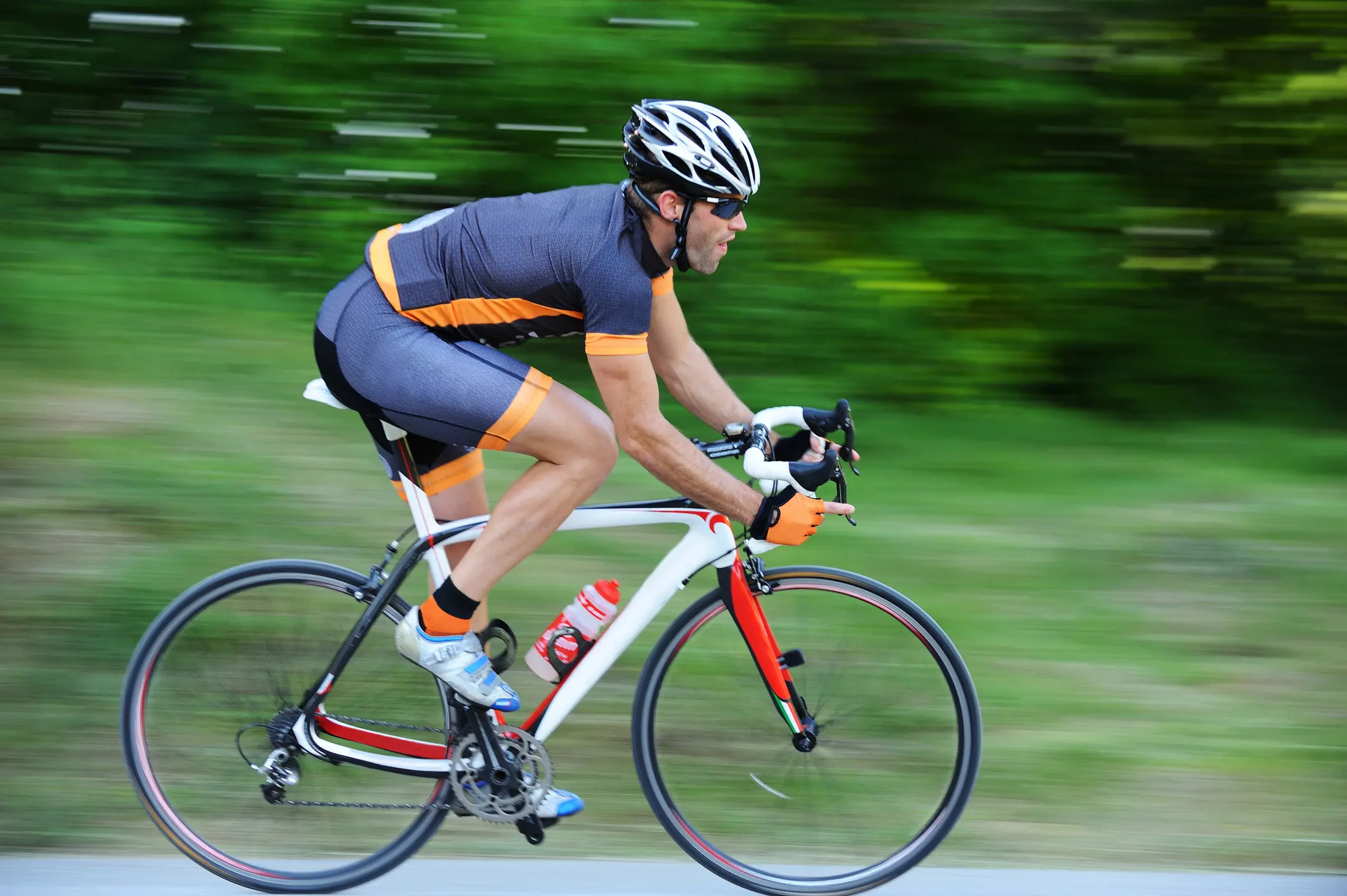 professional male cyclist on road bike